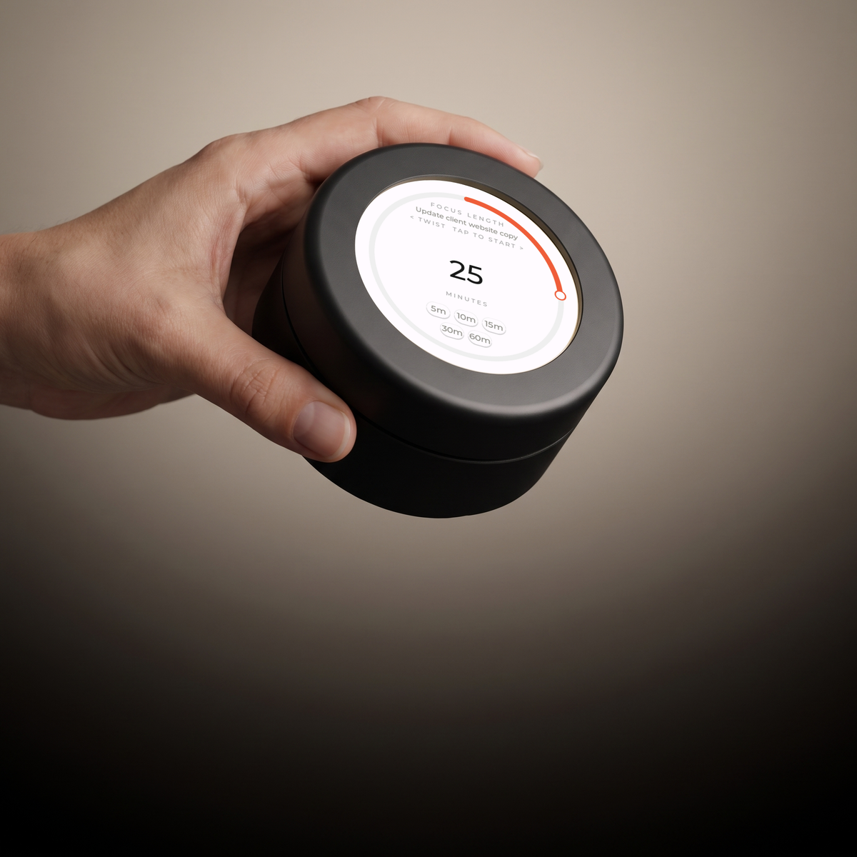 FW-1 Focus Wheel held in a hand, showing its scale